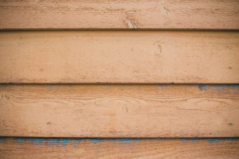 Full frame background of shabby wooden wall made of planks painted with beige color